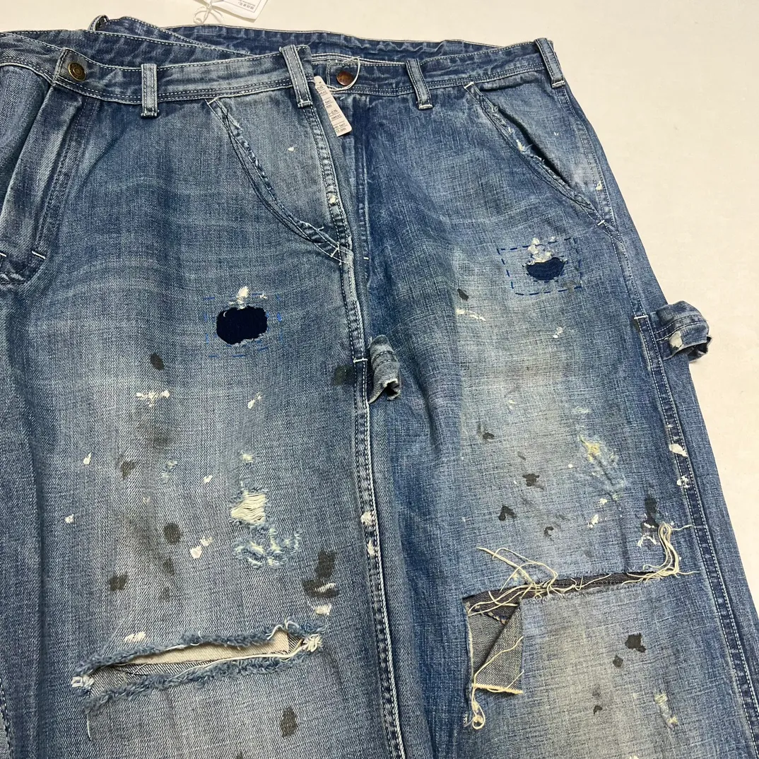Proofing VS ZP SAINT Mxxxxxx SAINT_DENIM PANTS/PAINTER /BLUE Knife cut holes and splashed ink logging trousers Patch jeans Blue S-XL All accessories are molded and customized Super heavy work Washed and worn Knife cut holes Artificial ink splashed graffiti Genuine version Loose and stylish